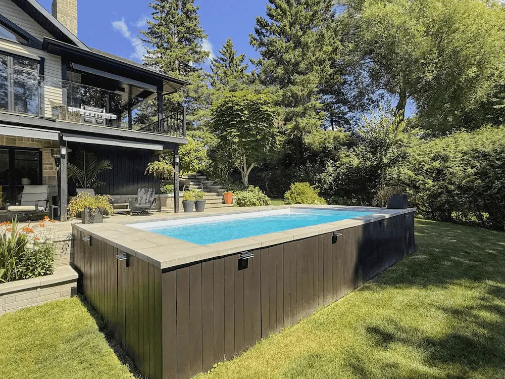 Above ground pool in a sunny backyard