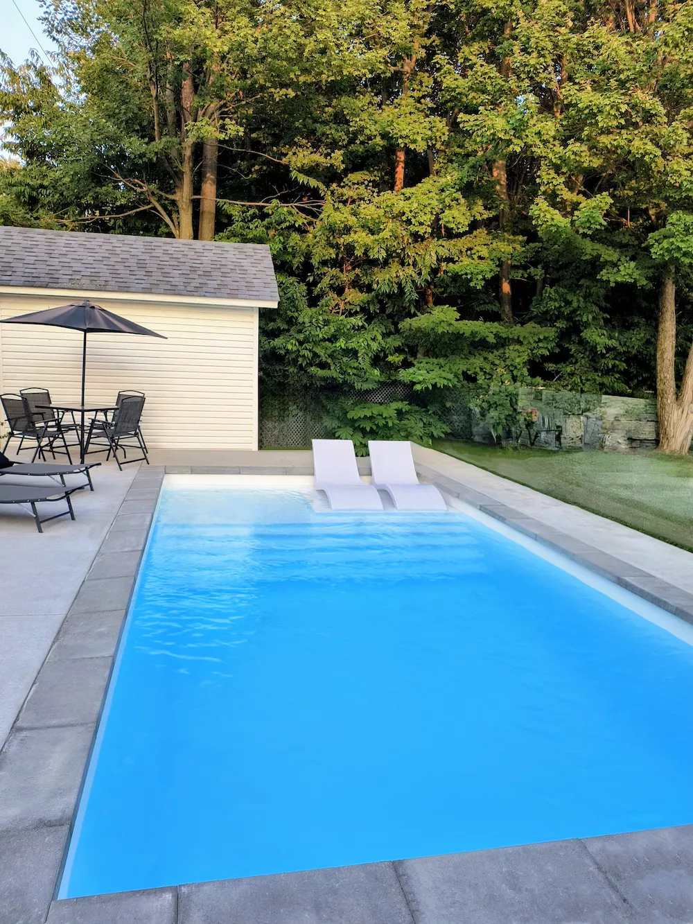 Technician removing a pool cover in spring